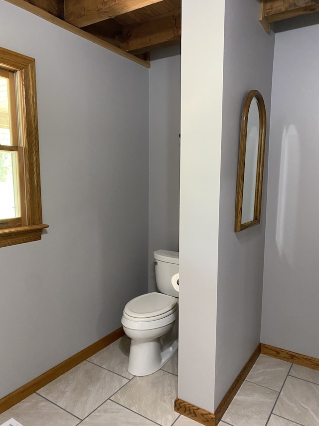 bathroom featuring toilet and tile patterned floors