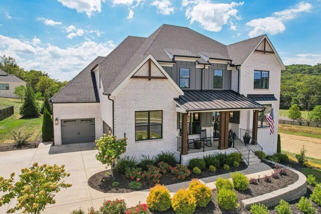 view of front of house with a garage and a porch