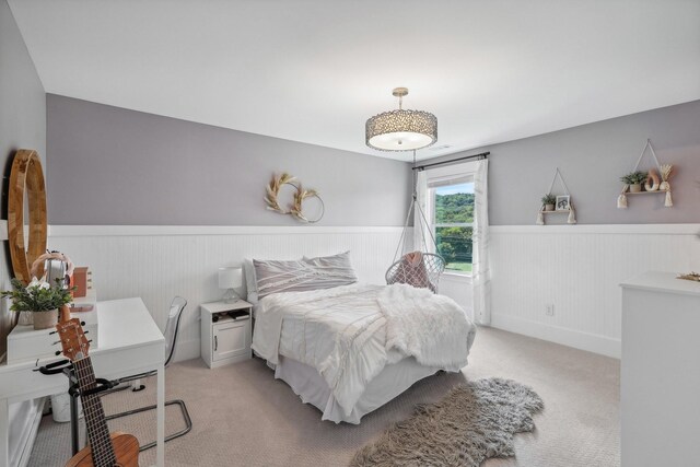 bedroom with light colored carpet