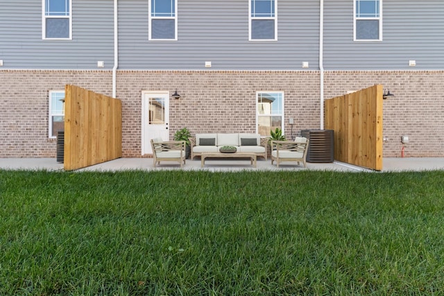 203 W Fallow Ct, Clarksville, TN 37040 - rear view of house with brick siding and an outdoor hangout area