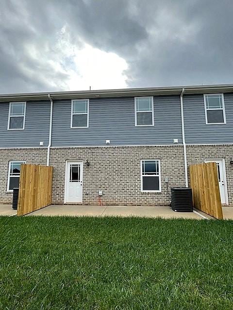 203 W Fallow Ct, Clarksville, TN 37040 - rear view of house featuring brick siding and a patio area