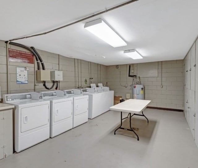 laundry room featuring washer and clothes dryer and electric water heater