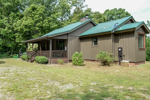 rear view of house with a lawn