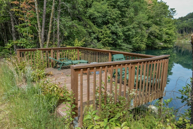 view of dock with a deck with water view