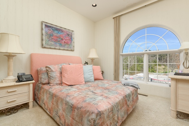 bedroom featuring light colored carpet