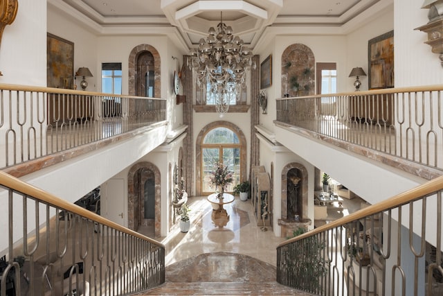 foyer featuring plenty of natural light and a high ceiling