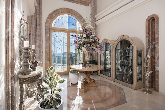 interior space featuring a towering ceiling