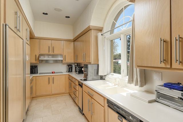 kitchen with light tile patterned flooring, sink, black electric stovetop, and light brown cabinets