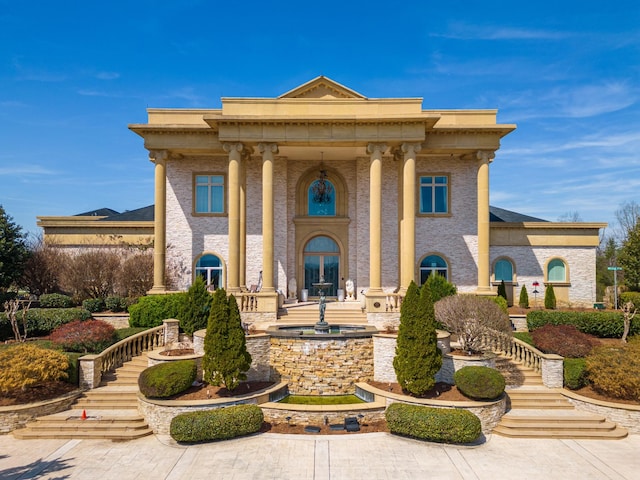 greek revival house featuring french doors