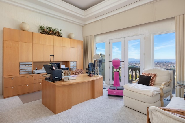 home office featuring french doors, light carpet, and a towering ceiling