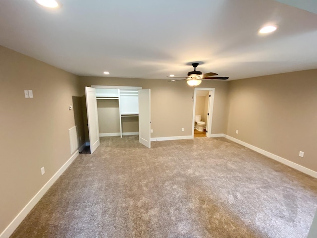 unfurnished bedroom featuring carpet floors, recessed lighting, ensuite bath, and baseboards