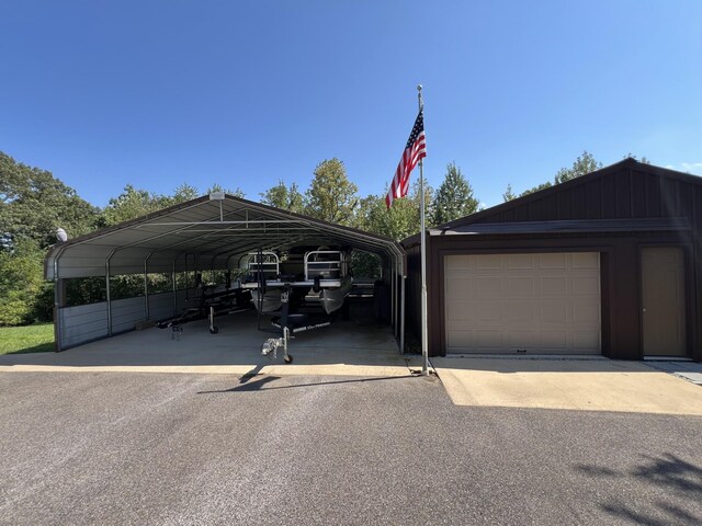 exterior space with a garage and a carport