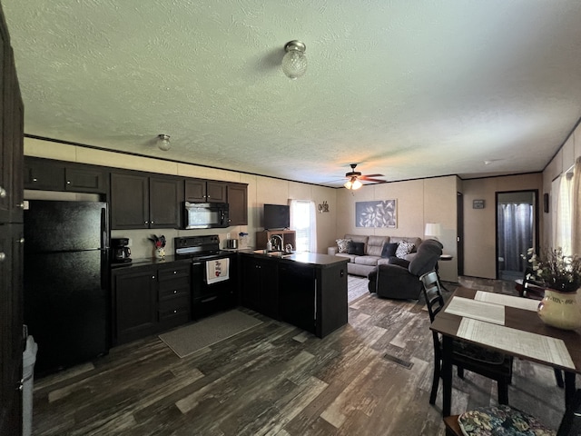 kitchen with kitchen peninsula, ceiling fan, black appliances, and dark hardwood / wood-style flooring