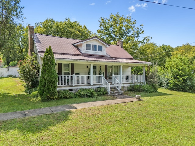 view of front facade with a front lawn and a porch