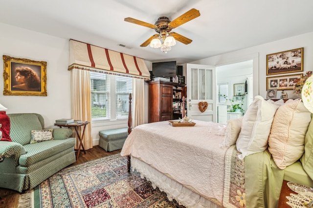 bedroom featuring ceiling fan and dark hardwood / wood-style flooring