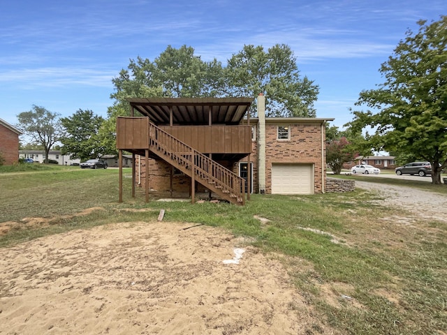 exterior space featuring driveway, an attached garage, and stairs