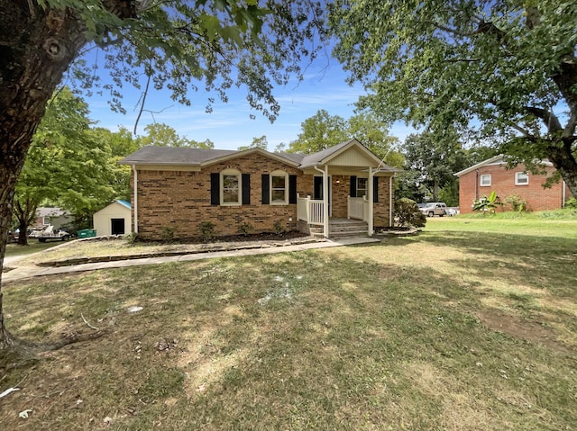 ranch-style home with a porch, a front lawn, and brick siding