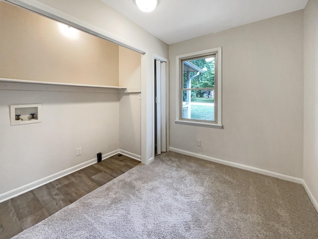 laundry area featuring carpet floors, laundry area, baseboards, and washer hookup