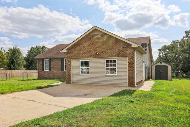 view of front facade with a storage unit, a patio area, and a front yard