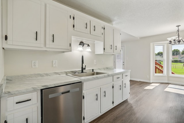 kitchen featuring white cabinets, stainless steel dishwasher, dark hardwood / wood-style floors, and sink