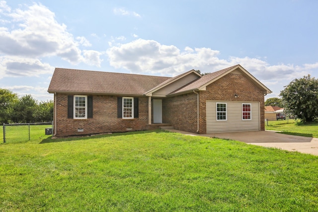 ranch-style home featuring a front lawn and a patio area