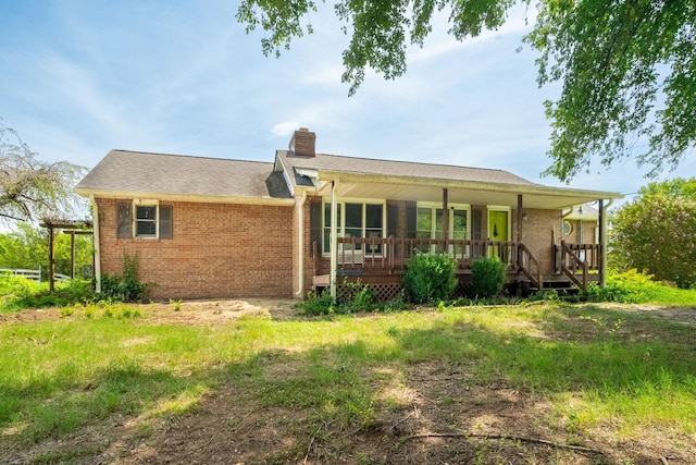 5016 Caney Sink Rd, Adams, TN 37010 - back of house featuring brick siding, a chimney, and a porch