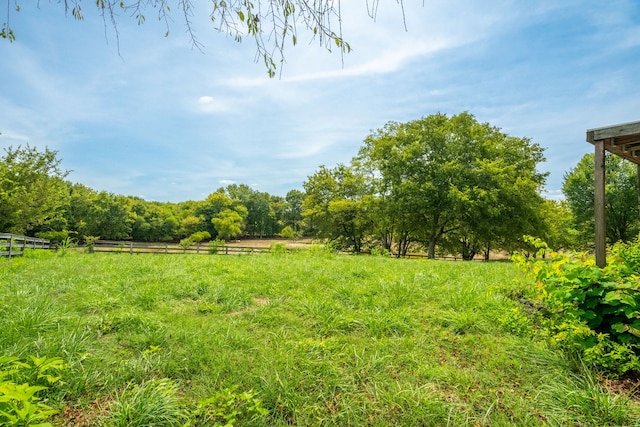 view of yard with a rural view