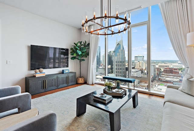 living room featuring a wall of windows and hardwood / wood-style flooring