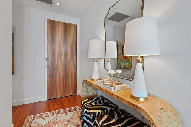 foyer entrance featuring dark hardwood / wood-style floors