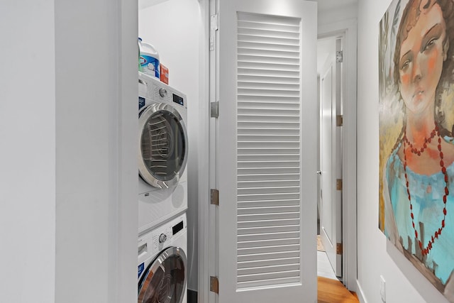 laundry area featuring stacked washer and clothes dryer