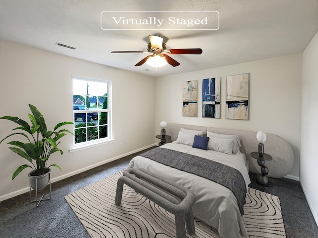 bedroom featuring ceiling fan and carpet floors