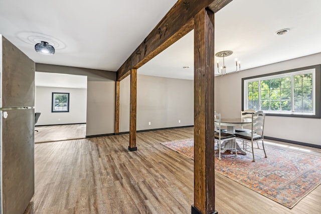 unfurnished dining area featuring light wood-type flooring