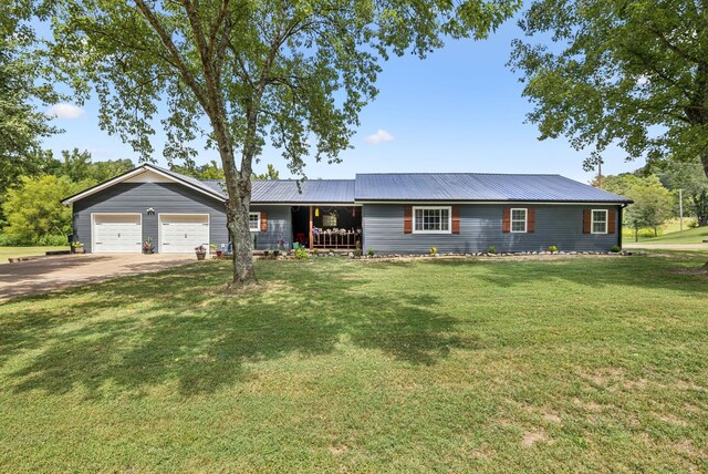 ranch-style home with a garage and a front lawn