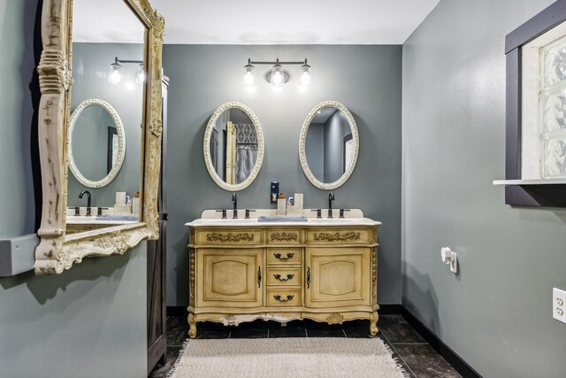 bathroom featuring tile patterned flooring and double sink vanity