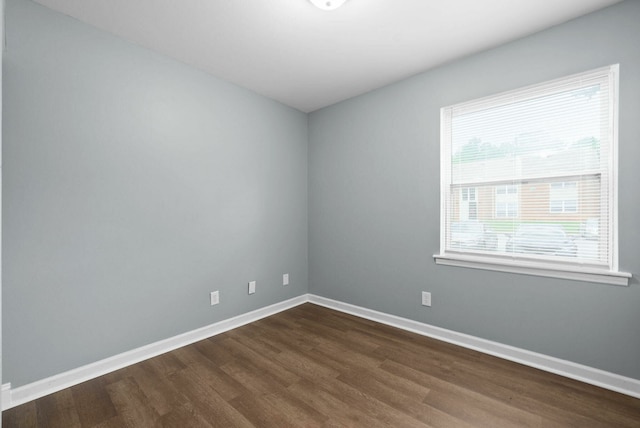 empty room with hardwood / wood-style flooring