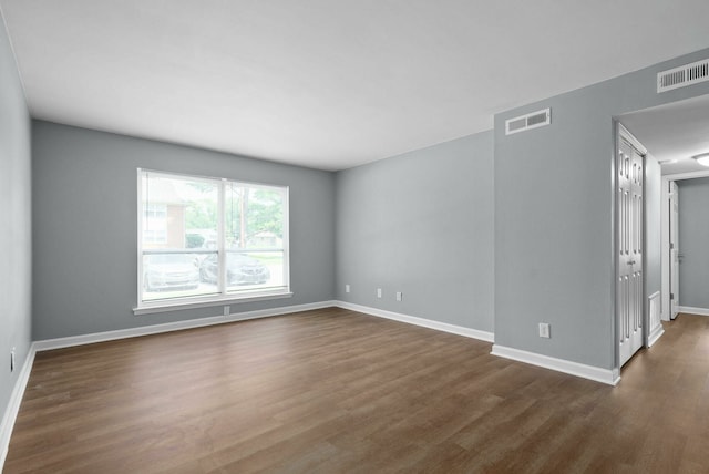 spare room featuring hardwood / wood-style flooring