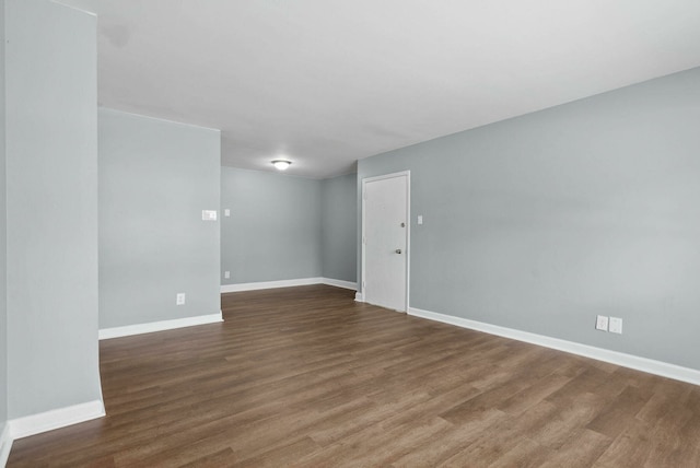 unfurnished room with wood-type flooring