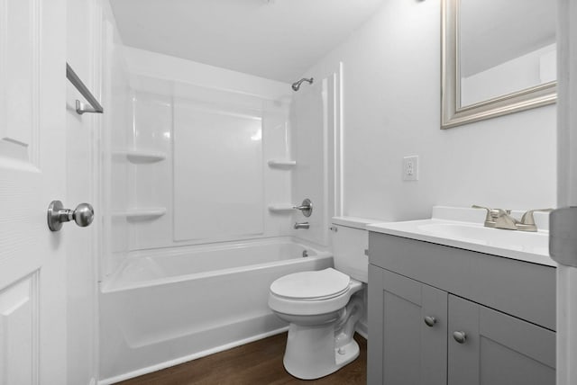 full bathroom featuring toilet, washtub / shower combination, vanity, and wood-type flooring