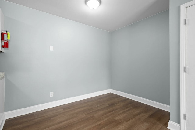 spare room featuring dark hardwood / wood-style floors