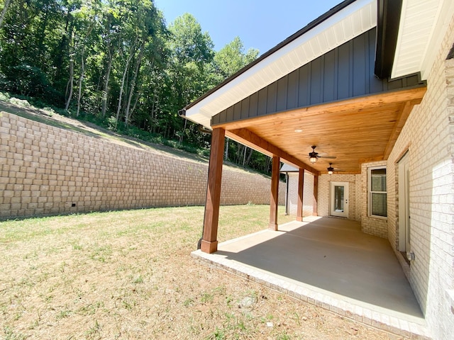 view of yard with ceiling fan, a patio, and a fenced backyard