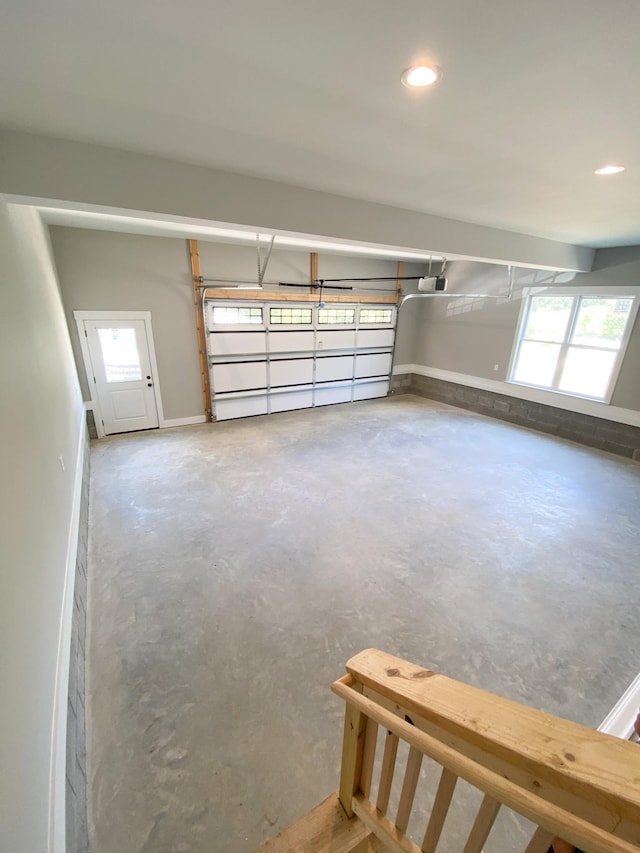 garage featuring recessed lighting and a garage door opener