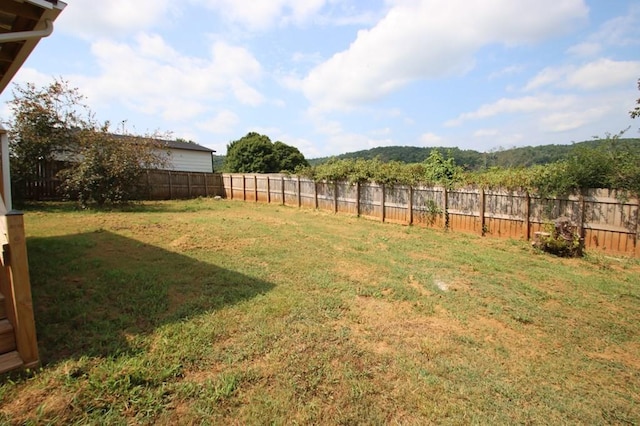 view of yard with a fenced backyard