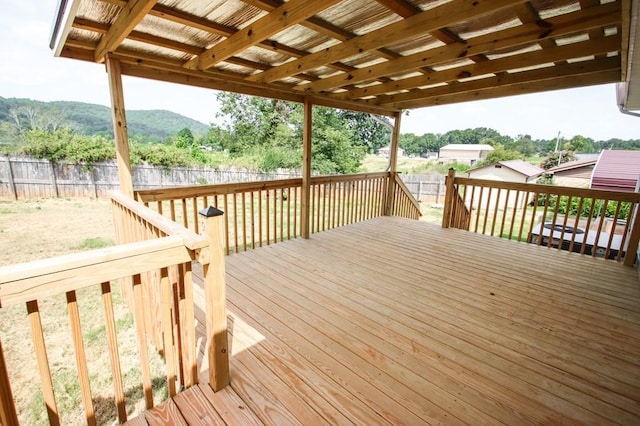 wooden terrace with fence and a mountain view