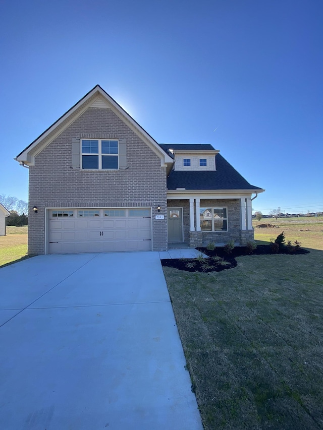 view of front facade featuring a garage and a front lawn