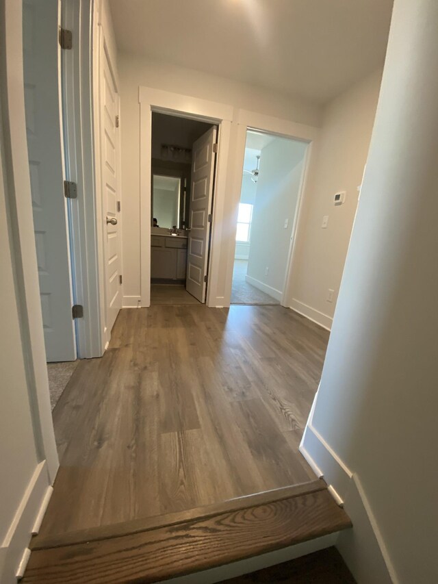 corridor featuring hardwood / wood-style floors