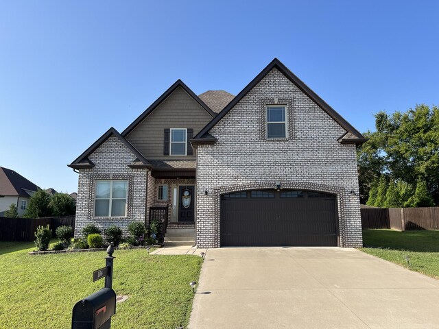 view of front facade featuring a garage and a front lawn