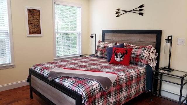 bedroom featuring dark wood-type flooring