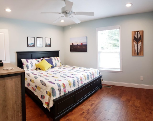 bedroom featuring ceiling fan and dark hardwood / wood-style floors