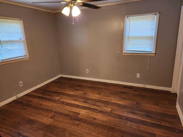 empty room featuring ceiling fan, hardwood / wood-style floors, and ornamental molding