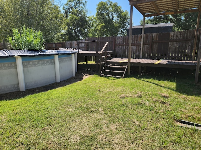 view of yard featuring a pool side deck